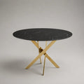Tavolo da pranzo rotondo in pietra sinterizzata effetto marmo nero con gambe in acciaio inox dorato, Ø 120 × 75 cm